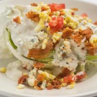 Morton'S Iceberg Wedge · Morton's Signature Salad, Cherry Tomatoes, Chopped Egg, Crispy Bacon & Crumbled Blue Cheese.