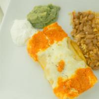 Enchiladas · Two Hand-Rolled Corn Tortillas Served with Red Rice, Red Beans, Sour Cream.