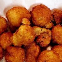 Fried Mushrooms · Button mushrooms are battered and fried in oil for an irresistible snack.
