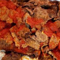Iskender Kebab · Traditional grilled and spiced lamb and beef meat served over toasted lapinja bread with tom...
