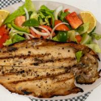 Trout Salad · Grilled trout served with salad and homemade garlic sauce.