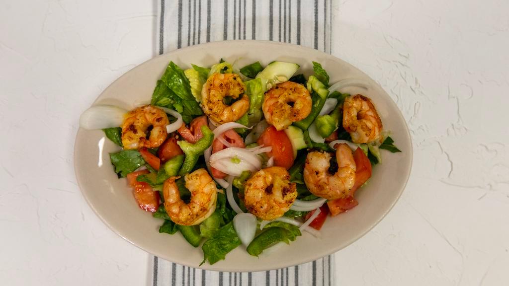 Shrimp Salad · Fresh shrimp layered with mixed greens, cucumbers, onions and peppers tossed in our house dressing.
