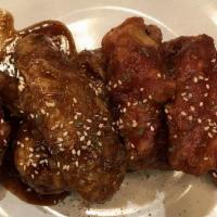 Korean Chicken · Baffoni farm deep fried Korean style wings with a choice of sauces.