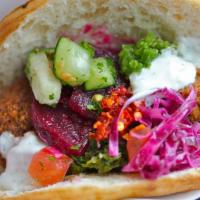 Regular Falafel Sandwich · Five falafel balls loaded with your choice of toppings and sauces.