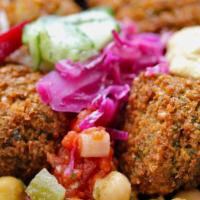 Regular Falafel Bowl · Five falafel balls loaded with your choice of toppings and sauces.