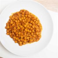 Chana Masaala · ￼Vegan, gluten free. Chickpeas, cooked onions, tomato and spices.