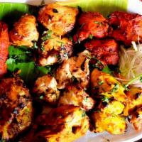 Royal Mixer · Includes chicken tikka, tandoor chicken, seekh kabab, 2 naans, salad, yogurt, chickpeas & ri...