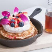 Lemon Ricotta Pancakes · Lemon ricotta pancakes with whipped ricotta, fresh berries, citrus curd, edible petals, free...