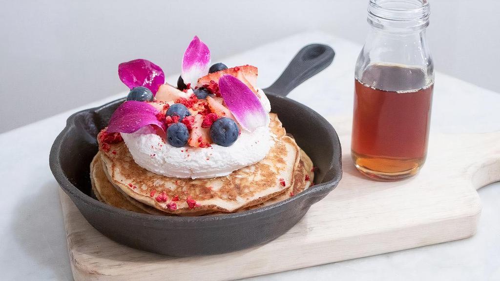Lemon Ricotta Pancakes · Lemon ricotta pancakes with whipped ricotta, fresh berries, citrus curd, edible petals, freeze dried raspberries & maple syrup..  . Allergens: G = Contains gluten, D = Contains dairy, E = Contains egg, S = Contains soy