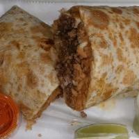 Burritos · Large Flour tortilla Burrito filled with Rice,Beans and your choice of meet.