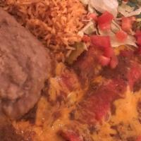 Three Cheese Enchilada Dinner · Three cheese enchiladas topped with homemade chile con carne and cheddar cheese.