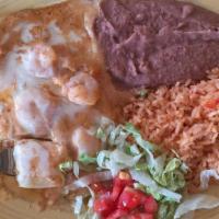 Seafood Enchiladas · Two enchiladas filled with shrimp, topped with monterey jack cheese, a seafood cream sauce, ...