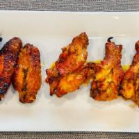 6 Pieces Chicken Wings · Grilled marinated chicken wings.