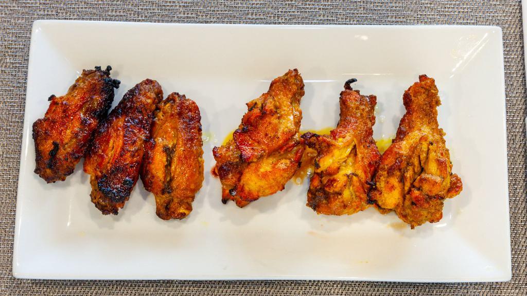 6 Pieces Chicken Wings · Grilled marinated chicken wings.