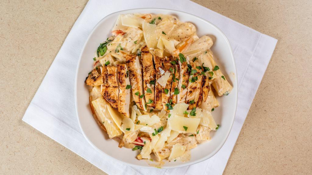 Oishi Pasta · Seasoned rigatoni pasta tossed with grilled chicken spinach & peppers simmered in our Cajun cream sauce.