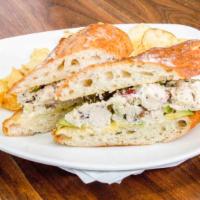 Chicken Salad Sandwich · Tossed chicken in mayo and mustard with cranberries, celery, pecans.  Served on a homemade b...