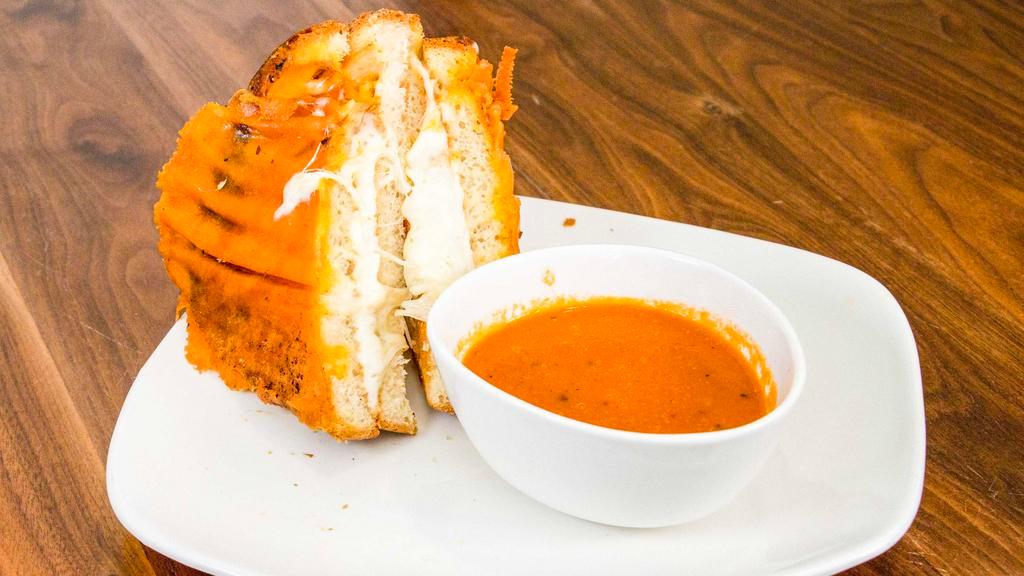 Grilled Cheese · Kid-friendly. Cheddar, Swiss cheese, and mozzarella melted on our brioche bread