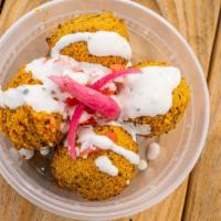 Falafel · A deep-fried ball patty, made from ground chickpeas, herbs and spices, served with basmati r...