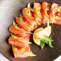 Salmon Ceviche · 8 pieces of salmon sashimi style topped with mango, tomato, jalapeno, cilantro, sea salt, ho...