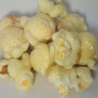 Cheesecake Popcorn · Candy-coated popcorn with Cheesecake flavor and white color.