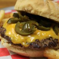 Cheeseburger Pizza · Burger meat, onions, pickles, cheddar cheese and mustard drizzle.