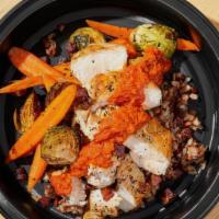 Grilled Chicken Bowl · Chicken breast, roasted red pepper sauce, wild rice, carrot, brussel sprout, bacon.