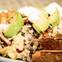 The Favorite · 3 eggs scrambled with goat cheese, sun-dried tomatoes, avocado, mushrooms and basil. Served ...