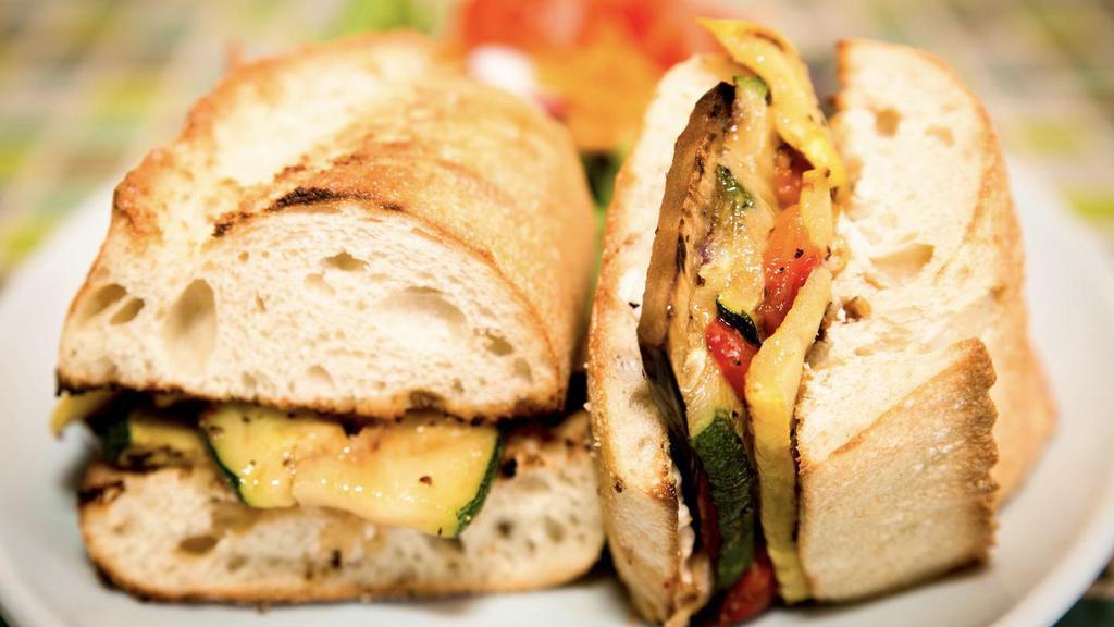 Vegetarian Sandwich · Goat cheese, eggplant, zucchini, roasted red peppers, yellow squash, red onions, roasted tomatoes and chipotle mayo. Served with mixed green salad, french fries, sweet potato fries, Kettle chips or onion rings.