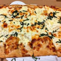 Bianco · White sauce, fresh mozzarella, ricotta, mozzarella, fresh basil.