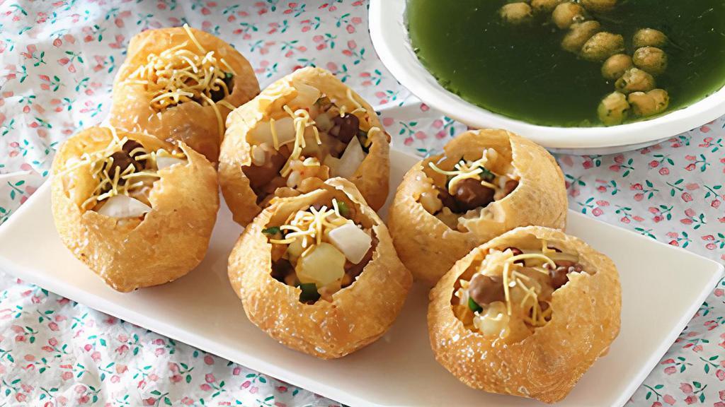 Pani Puri · Vegan. Hollow crispy puffs with potatoes, chickpeas, and tamarind sauce, served with spicy water.