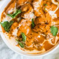 Butter Chicken · Chicken cooked in a creamy tomato sauce.

Served with rice