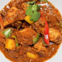 Kadhai Chicken · Chicken with bell peppers and onions.

Served with rice