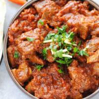 Lamb Kadhai · Tender lamb with bell peppers and onions.

Served with rice