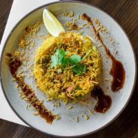 Bhel Puri · Vegan. Puffed rice, chickpeas, cilantro, onions, mint, and tamarind sauce.