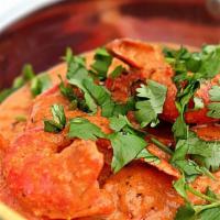 Shrimp Tikka Masala · Shrimp with bell peppers and onions in a tomato and onion gravy. 

Served with rice.