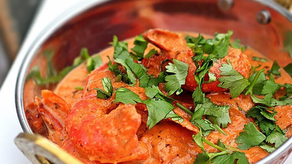 Shrimp Tikka Masala · Shrimp with bell peppers and onions in a tomato and onion gravy. 

Served with rice.