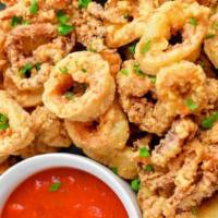 Fried Calamari · Fresh pieces of calamari fried to golden crisp served w/marinara sauce