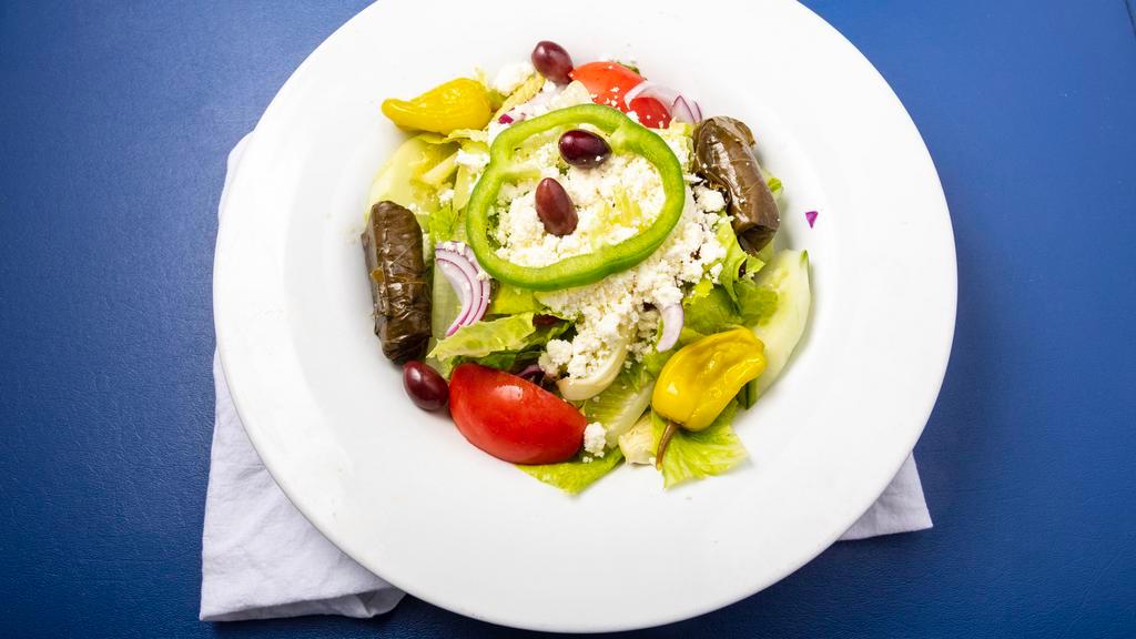 Greek Salad · Romaine lettuce, tomatoes. cucumber, kalamata olives, pepperoncini, onions, green peppers, stuffed grape leaves & feta. Add chicken, gyro, shrimp, salmon or steak for an additional charge.