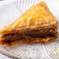 Baklava · Gooey layers of filo pastry dough, cinnamon, walnuts and a glazing of Cretan honey with hint...