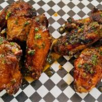 Kickass Wings · (8) fried wings with your choice of 2 flavors: (includes ranch dressing with celery/ carrot ...