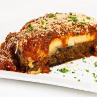 Moussaka · Layers of sauteed eggplant and ground beef topped with bechamel.