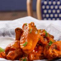 Sweet Chili Thai Wings · Deep-fried chicken wings tossed in our sweet chili Thai sauce. Comes with your choice of dip...