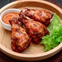 Bbq Wings · Deep-fried chicken wings tossed in our BBQ sauce. Comes with your choice of dip and side.