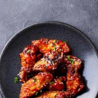 Korean Gochujang Wings · Deep-fried chicken wings tossed in our spicy Korean gochujang sauce. Comes with your choice ...