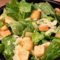 Caesar Salad · Fresh romaine tossed with shaved parmesan cheese, garlic croutons and creamy Caesar dressing.