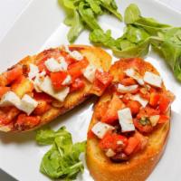 Bruschetta · Chopped fresh tomatoes with garlic, basil, olive oil, and mozzarella, served on toasted slic...