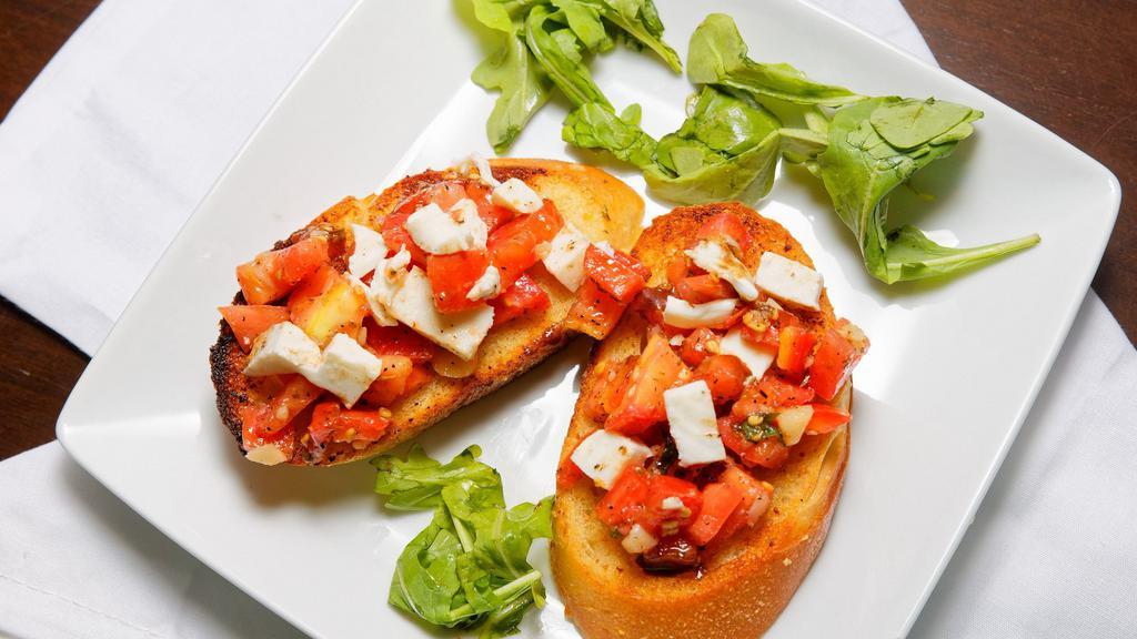 Bruschetta · Chopped fresh tomatoes with garlic, basil, olive oil, and mozzarella, served on toasted slices of Italian bread. Finished with drizzled balsamic.