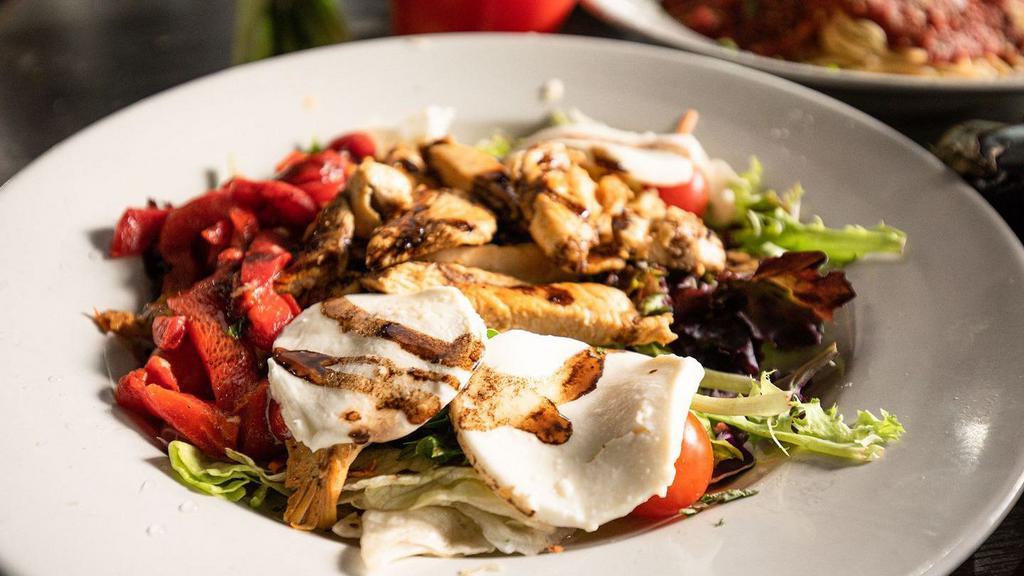 Chicken Mozzarella Salad · Mixed greens topped with fresh mozzarella, grilled chicken, roasted pepper topped with drizzled balsamic. House Balsamic Suggested.