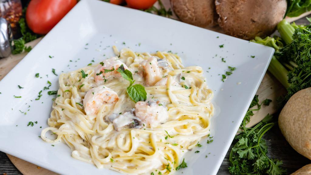 Shrimp Toscana · Prosciutto di Parma & Mozzarella in a Creamy Mushroom Sauce.