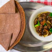 Derek Tibs · Lean beef or lamb diced and sautéed with onion, garlic, tomato, and Ethiopian herbal butter,...